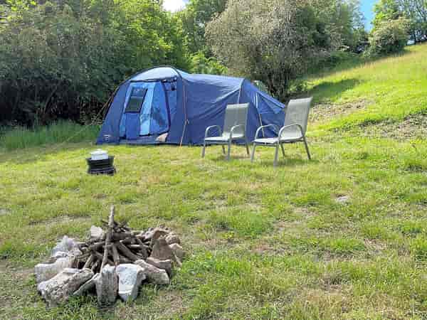 Non-electric grass and earth tent pitch