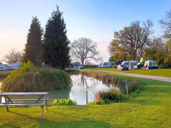Electric hardstanding and grass touring pitch