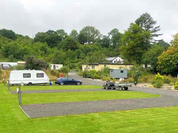 Powered cement/asphalt and grass site