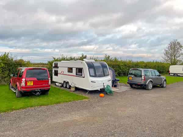 Electric hardstanding and grass pitch