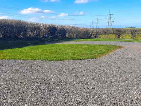 Electric hardstanding and grass touring pitch