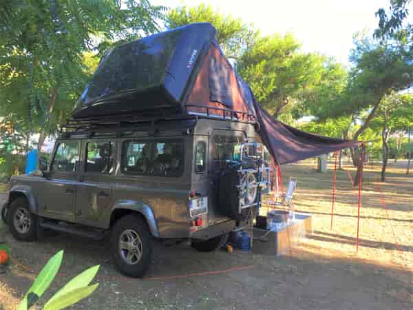 Electric hardstanding and grass touring caravan pitch