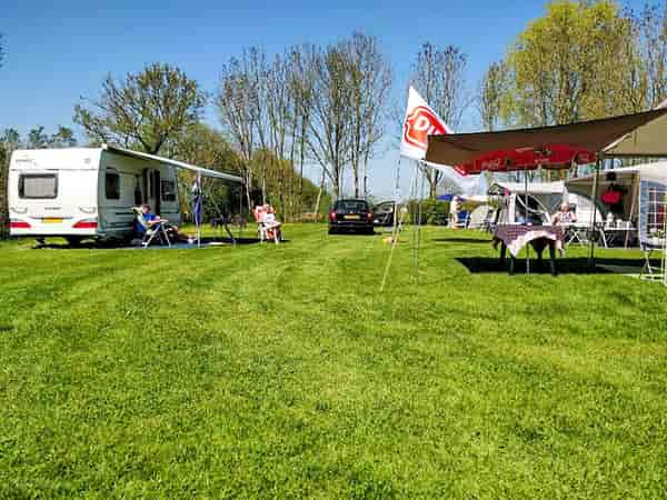 Electric grass and earth tent pitch