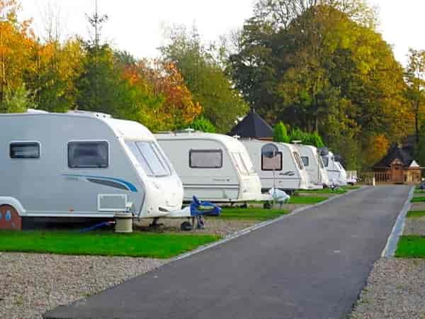 Electric hardstanding and grass touring caravan pitch (no awning)