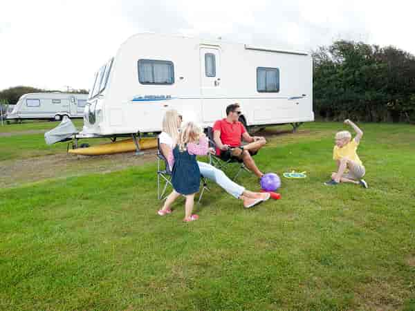 Electric grass tent pitch