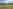 Non-electric grass and earth tent pitch