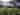 The Glade electric grass and earth tent pitch (riverside)