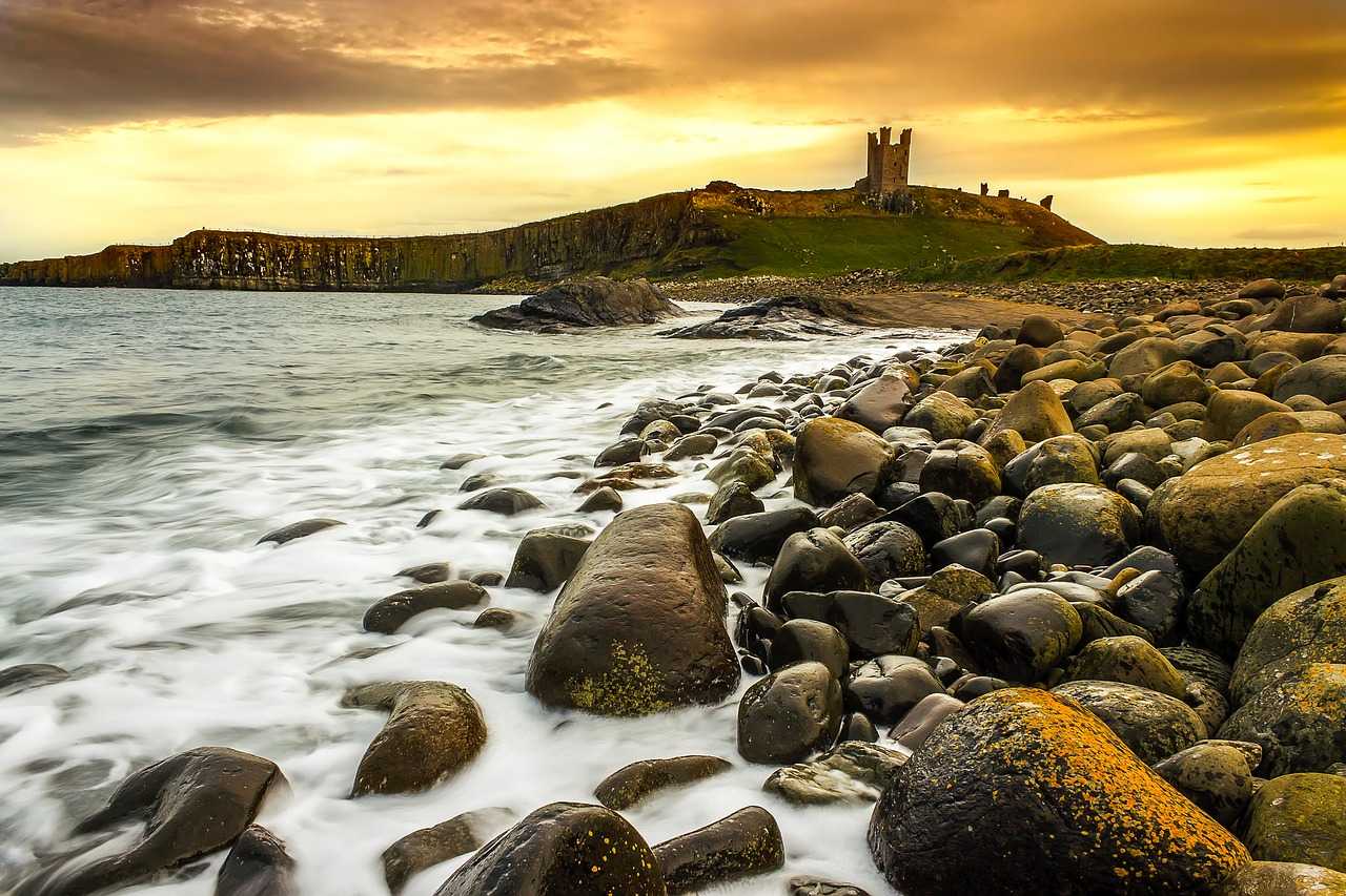 Dunstanburgh Castle at sunset (David Mark from Pixabay) 
