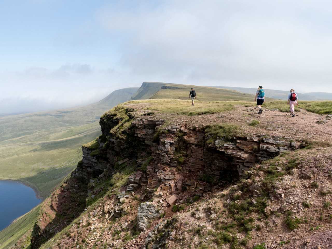 3 walkers in the brecon beacons on a sunny day