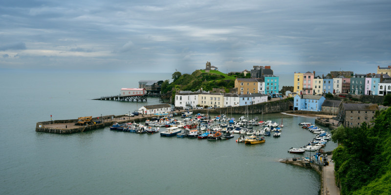 Tenby’s colourful harbour and castle (Jonathan Walters/Unsplash)