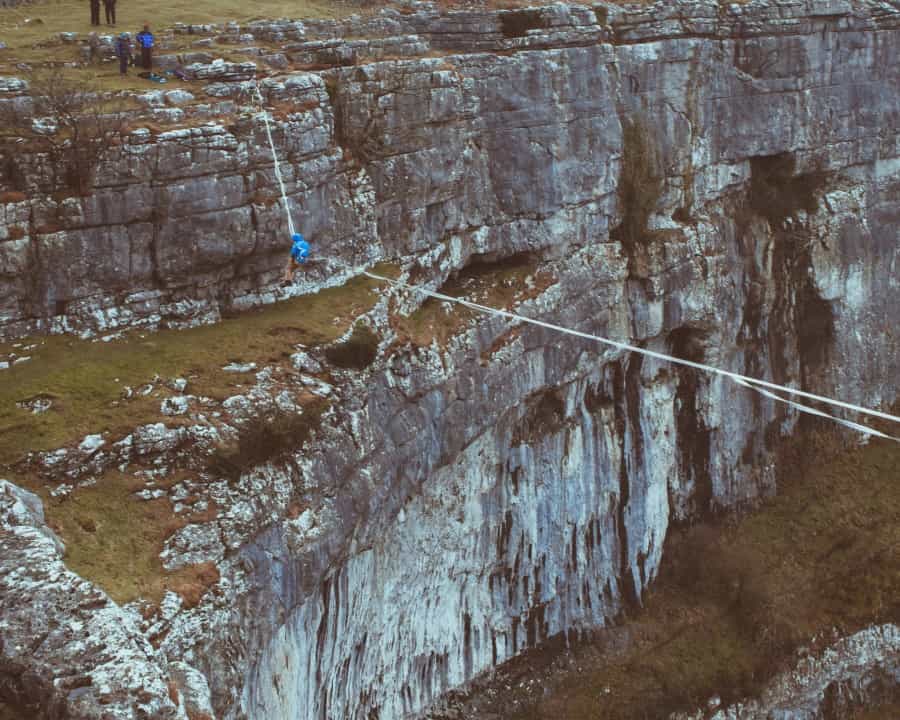 Using a highline to cross the gap at Malham Cove (Nate Williams/Unsplash)