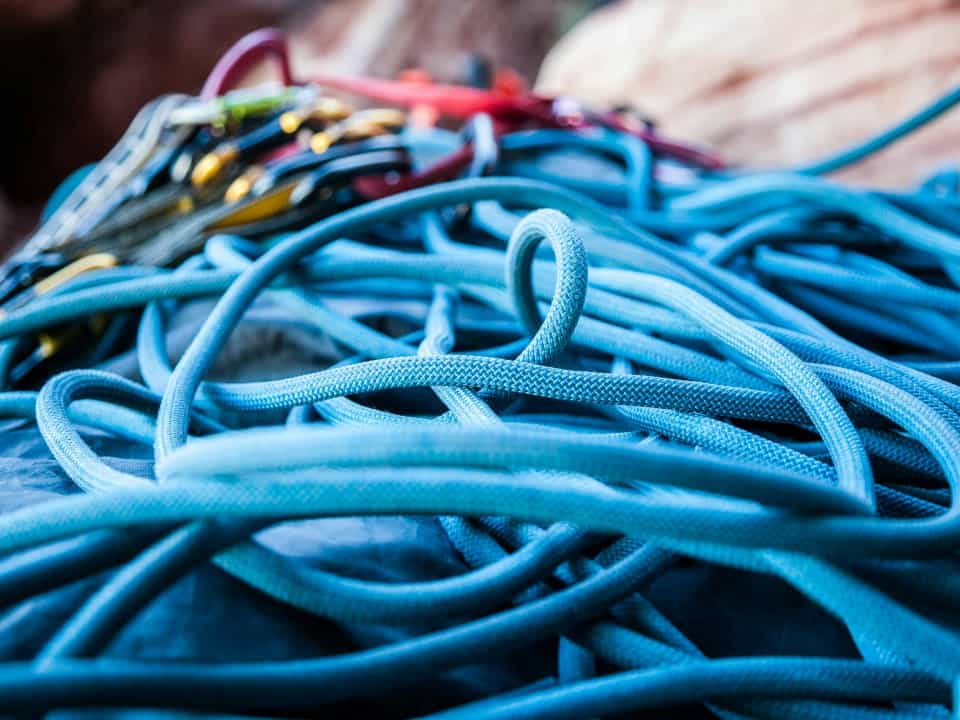 A mess of ropes on the floor, mainly blue