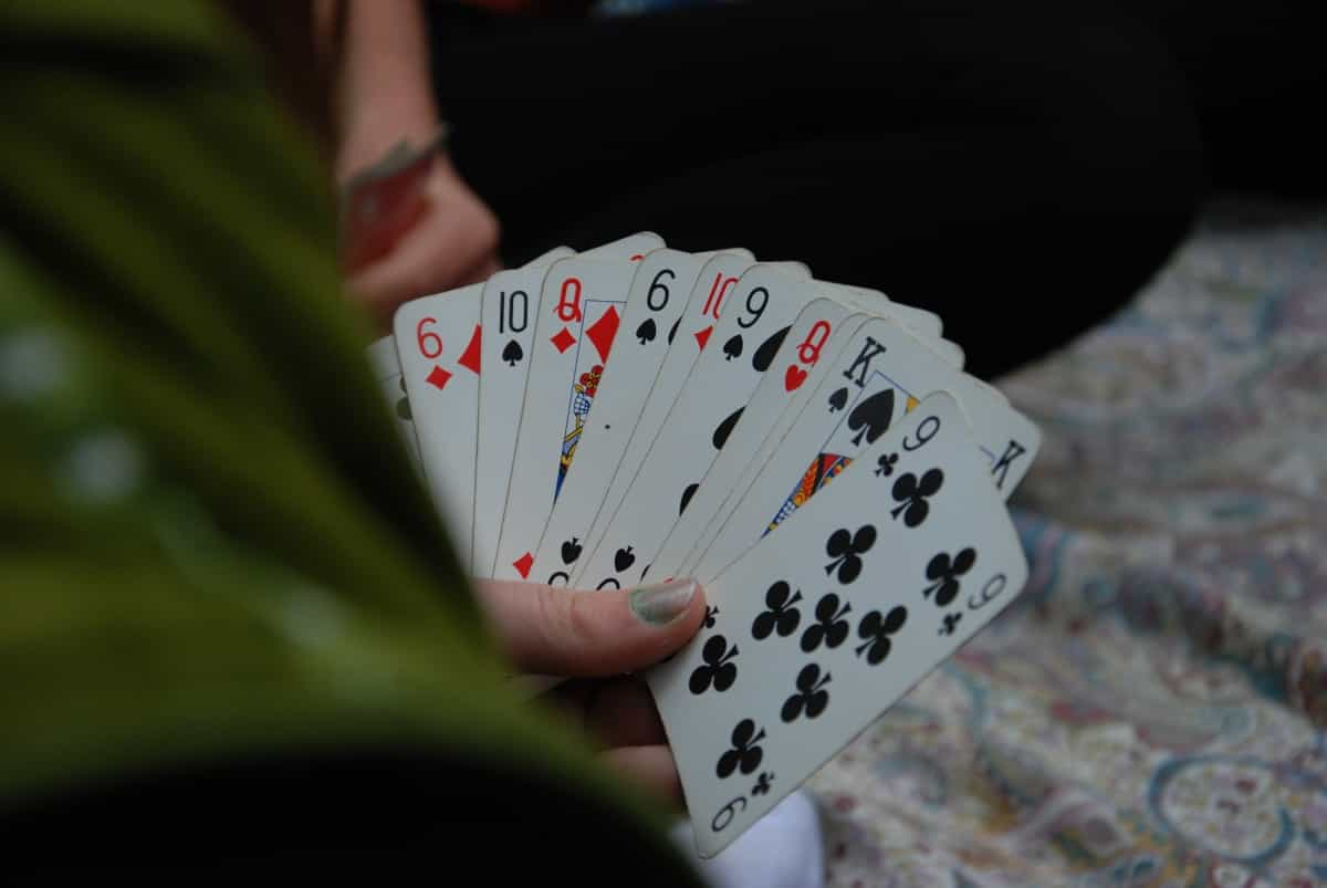 Bring along playing cards and other games ideas for a fun campsite evening (Alessandro Bogliari / Unsplash)