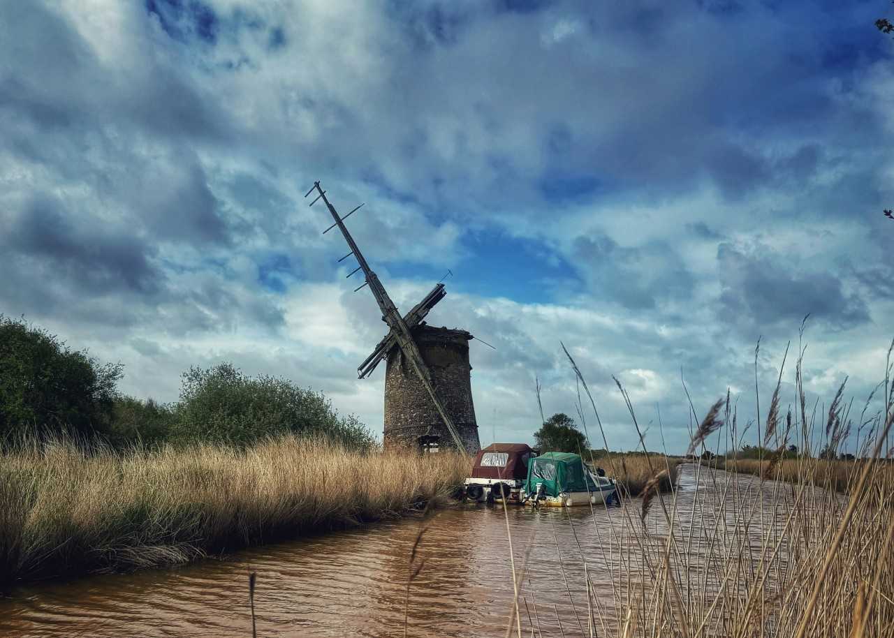 Walking is a wonderful way to explore the scenery in the Broads (Chris Spalton/Unsplash)