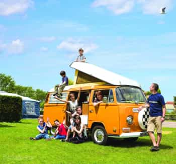 Grouping around a VW camper