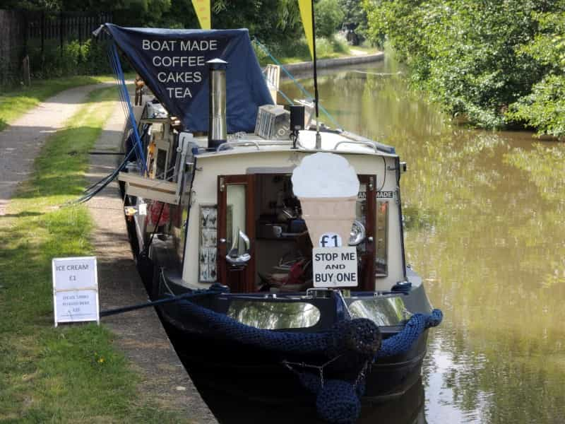 An ice cream boat on a Cheshire canal (Gibbon FitzGibbon on Unsplash)