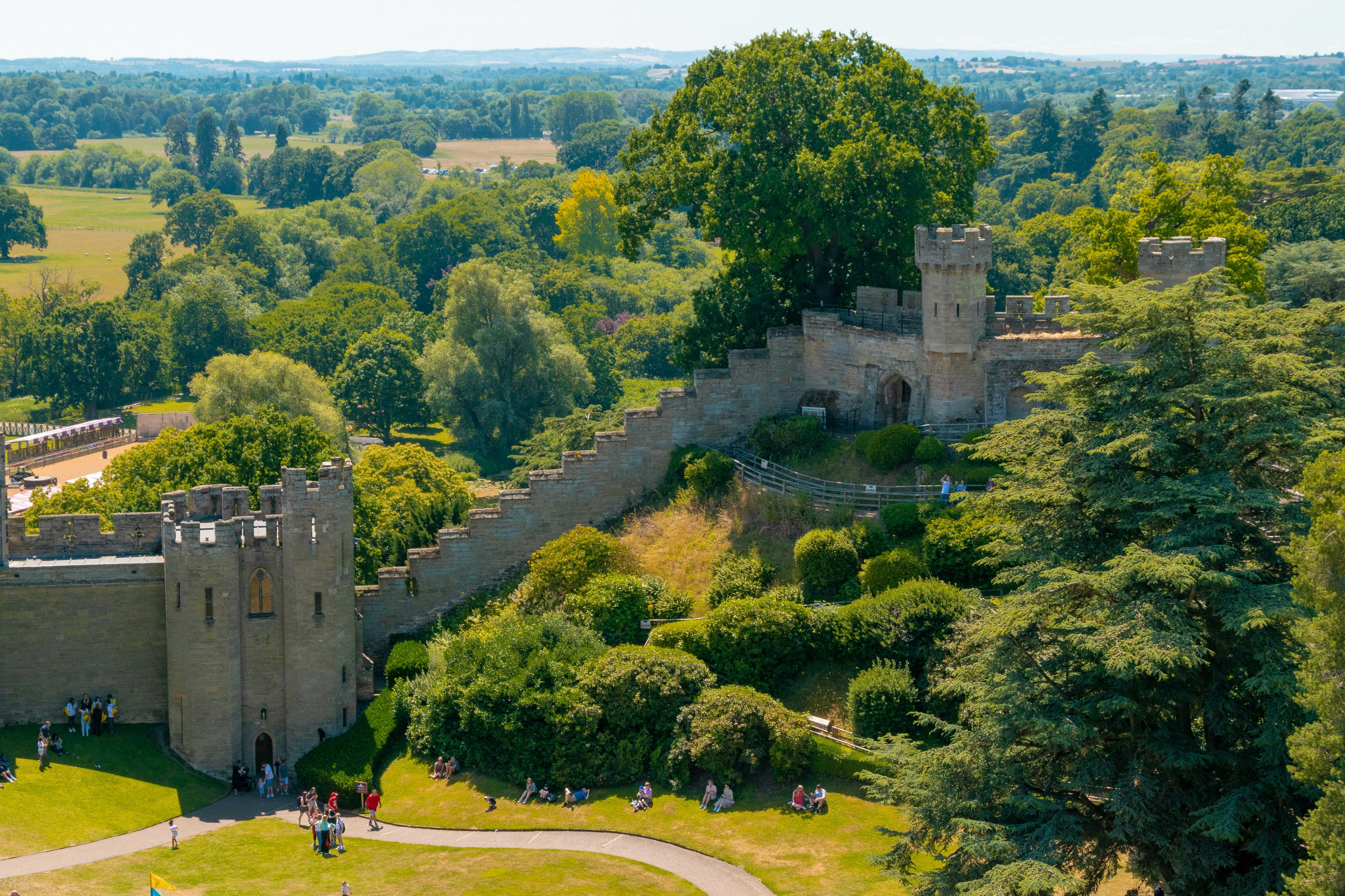 The battlements of Warwick Castle (Tom Podmore/Unsplash)