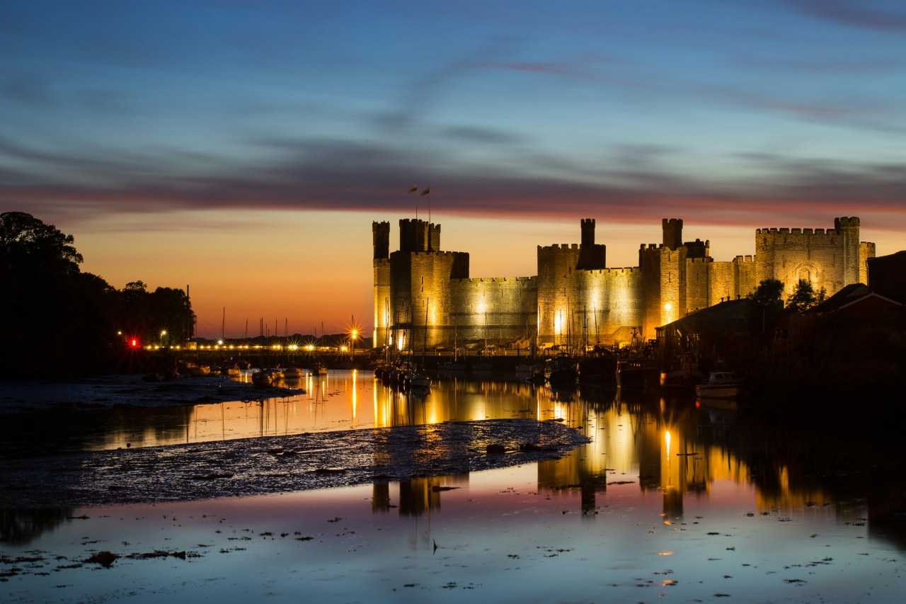 Golden hour at spectacular Caernarfon Castle (Neil Mark Thomas/Unsplash)
