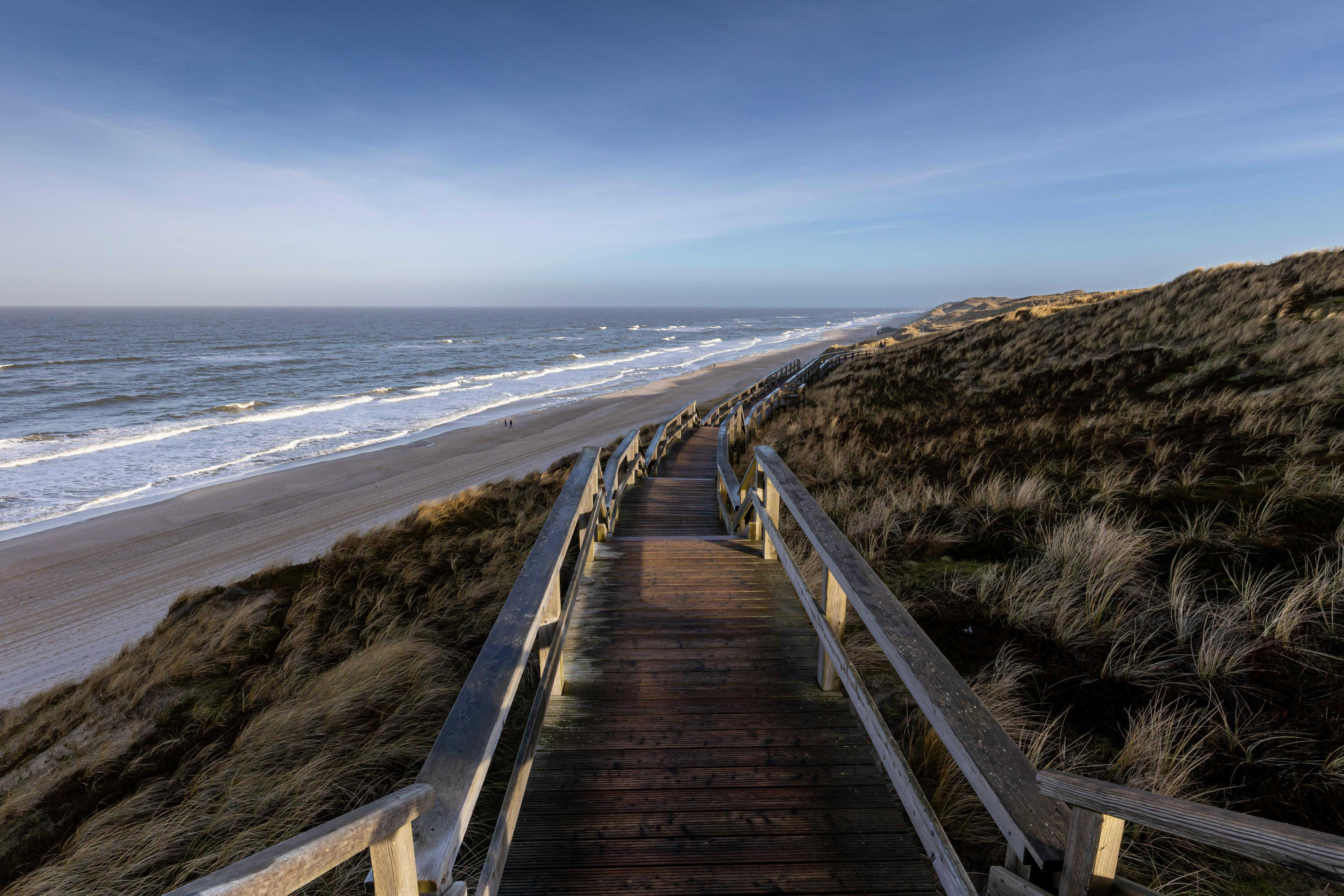 A wheelchair accessible boardwalk, leading down to a beach