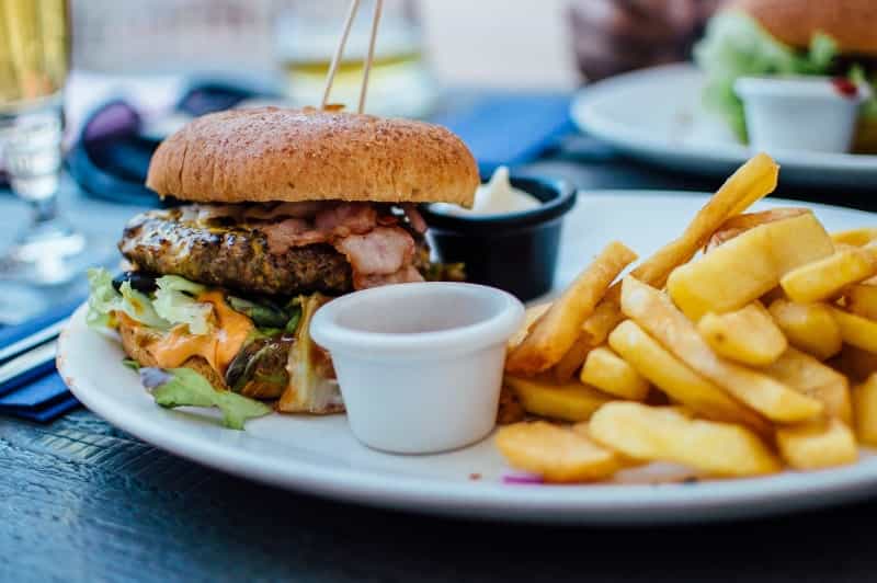 Sometimes only burger and chips will hit the spot (Robin Stickel on Unsplash)