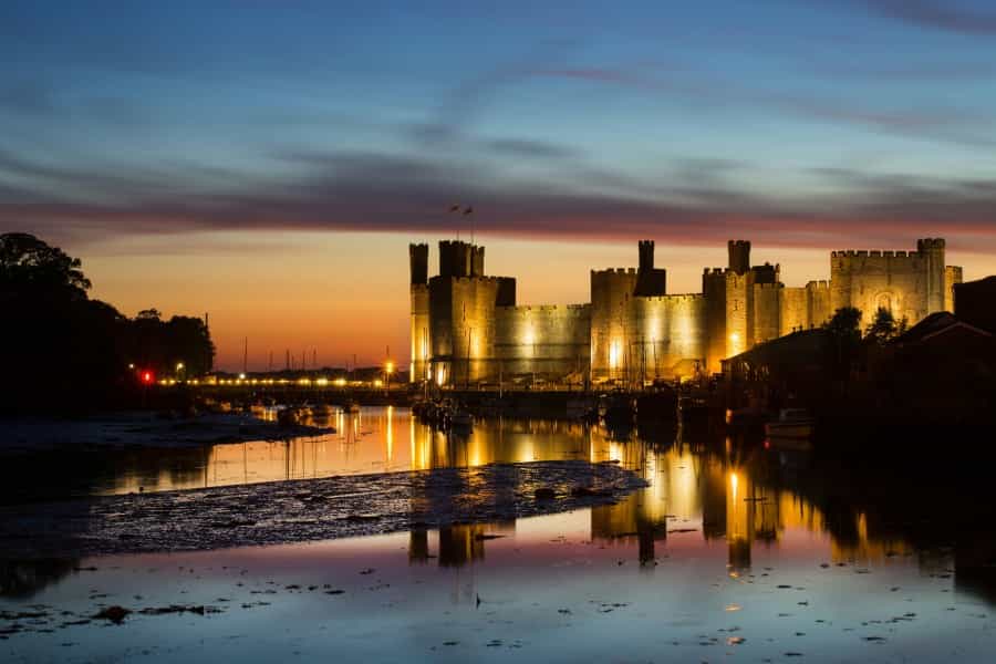 Caernarfon Castle at dusk (Neil Mark Thomas/Unsplash)