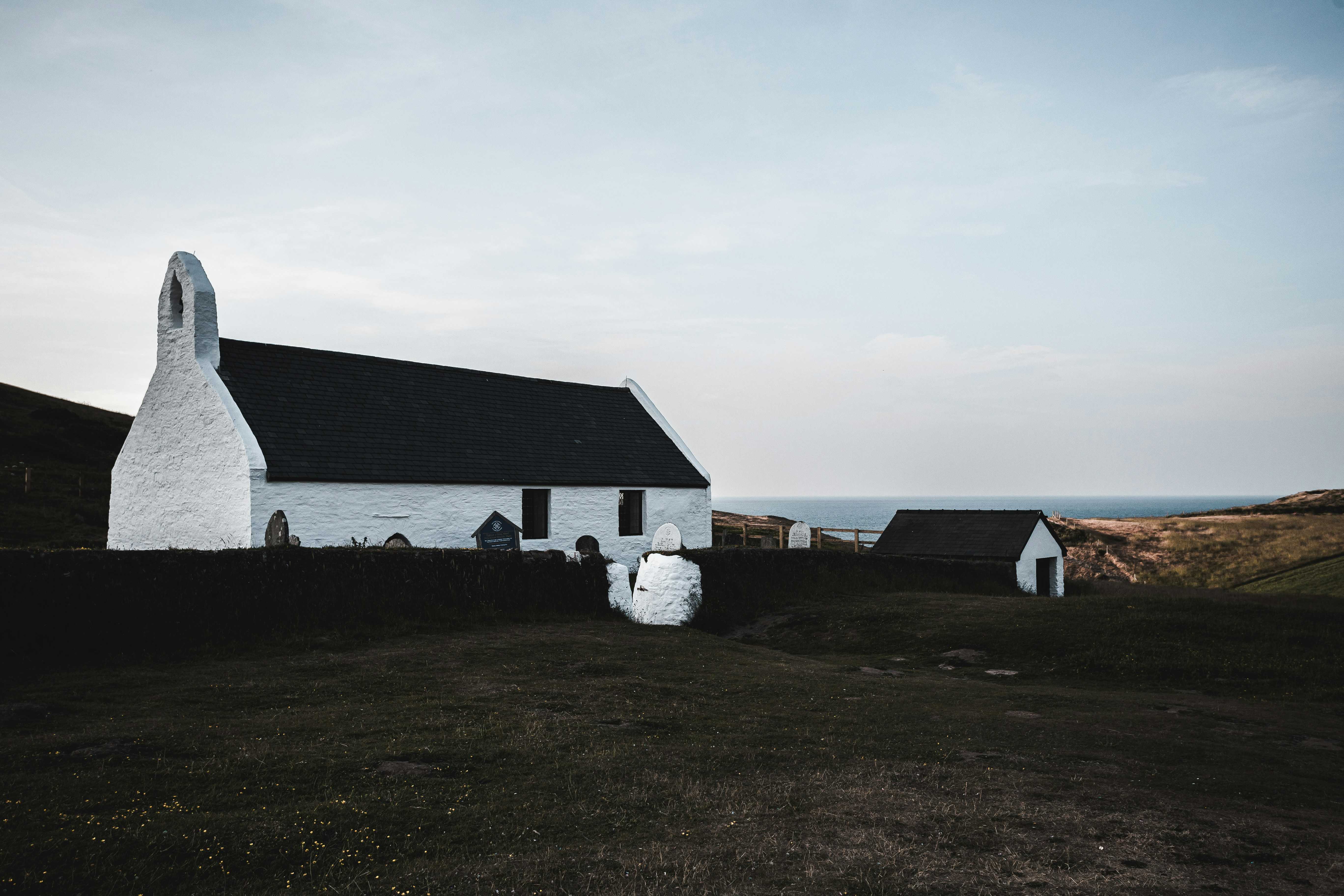 The historic Eglwys y Grog in Mwnt (Terra Strickland/Unsplash)