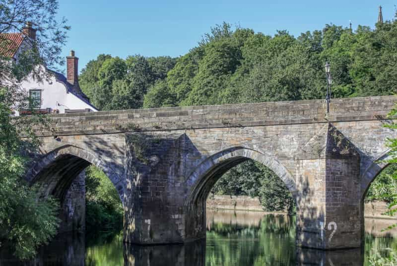 The patio at The Cellar Door overlooks Elvet Bridge (David Ross on Unsplash)