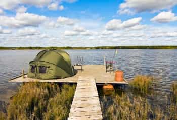 Angler's tent by fishing lake