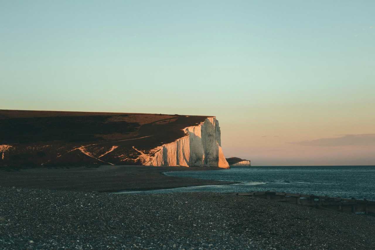 The spectacular Seven Sisters cliffs rising from the English Channel (Joseph Pearson/Unsplash)