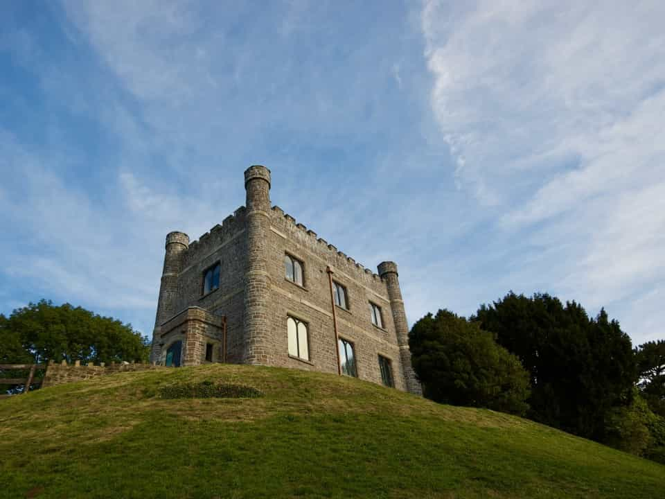 View up a hill towards a castle