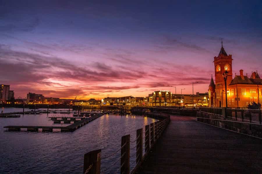 Cardiff Bay lit up at sunset (Nick Fewings/Unsplash)