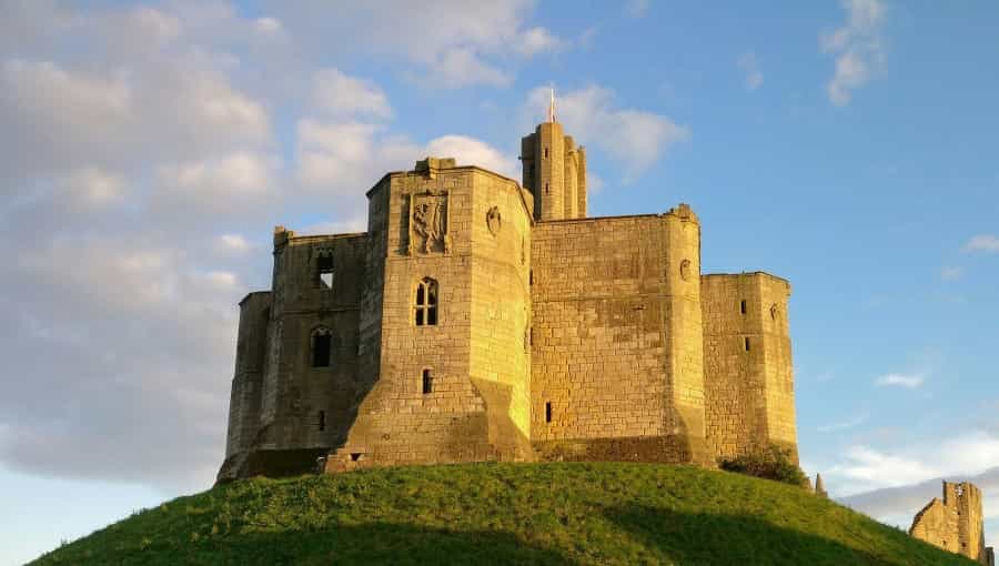 Warkworth Castle in the sunshine (Leon McGregor/Unsplash)