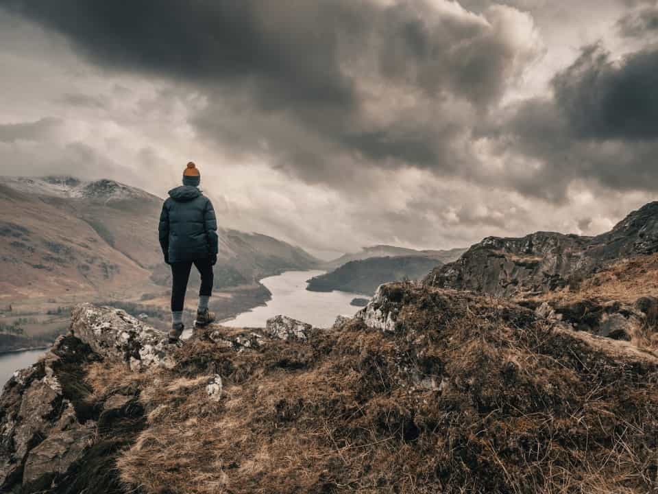 Walker looking out over Lake District scenery