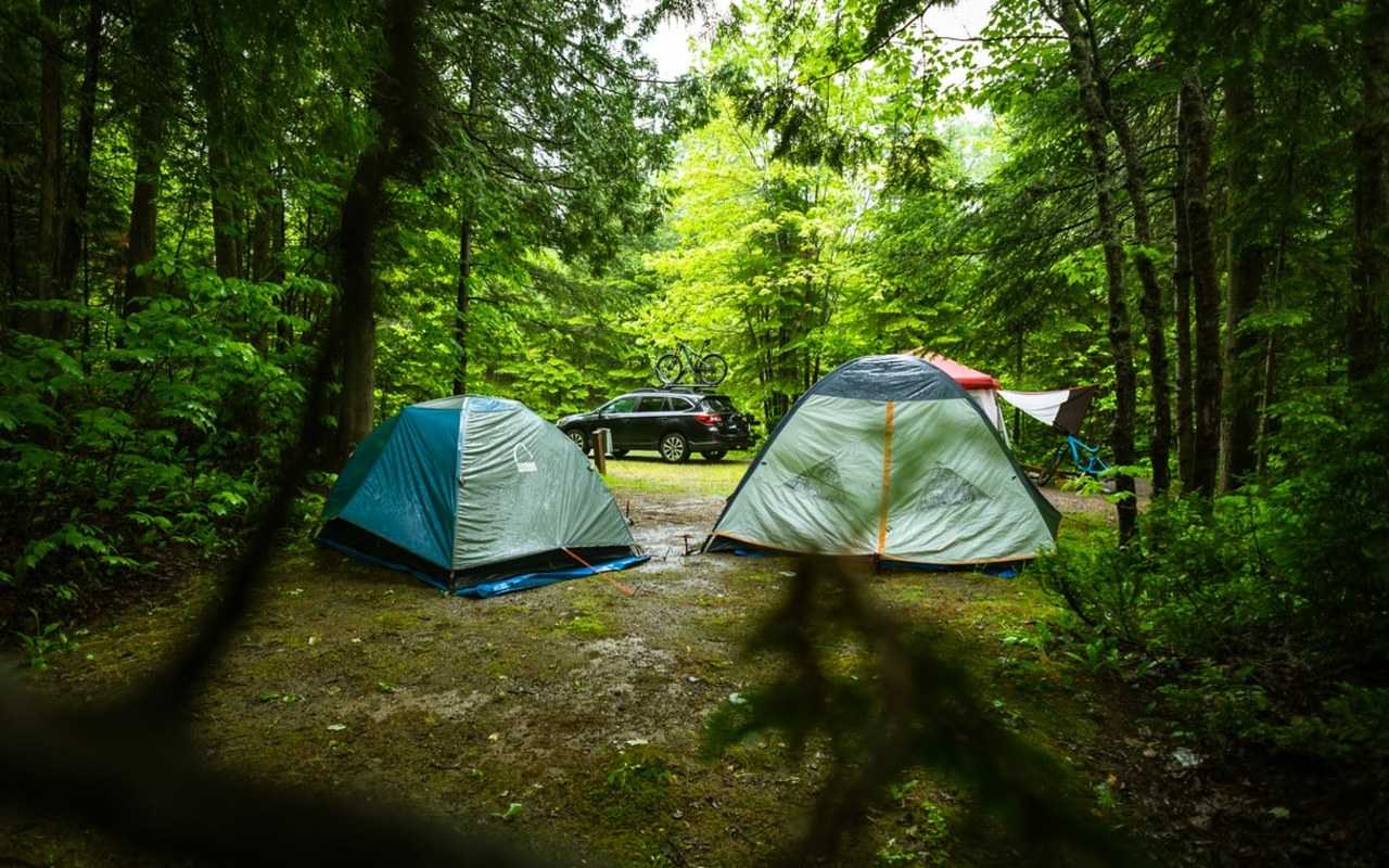 Packing away a tent in wet conditions isn’t ideal, but sometimes it’s necessary (Tim Foster / Unsplash)