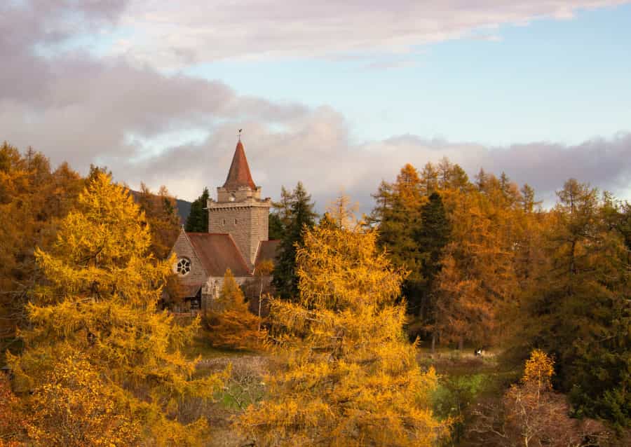 Crathie Kirk surrounded by trees in their autumn finery (Martin Bennie/Unsplash)