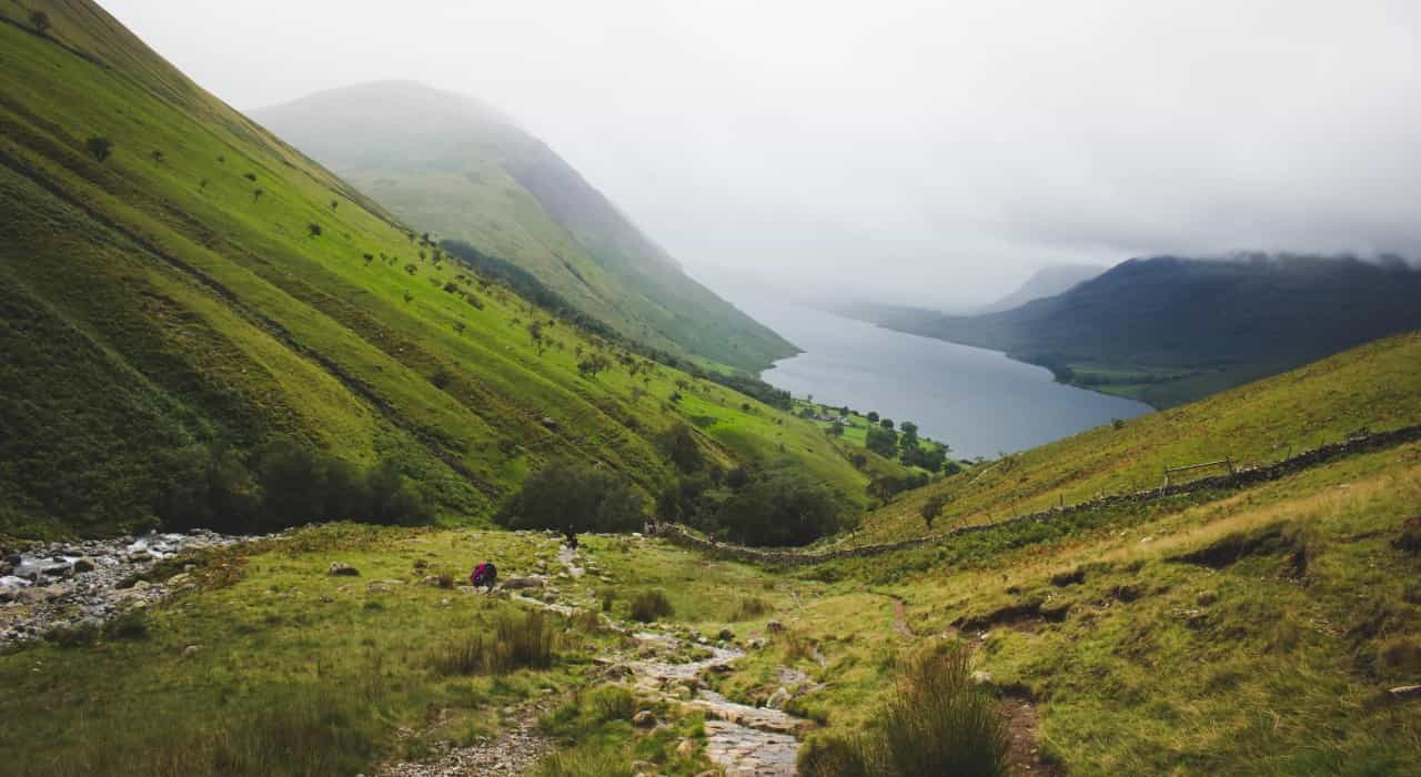 Looking down a valley while climbing Scafell Pike (George Bannister/Unsplash)