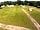 Leadstone Camping: High level view across Field 1 with the sea in the distance
