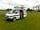 Grange Farm Lodge: Behind this van is the huge dog-walking area with paths cut through the grass