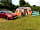 Porte Meadow Campsite: Cars next to pitches