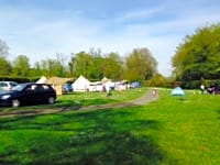 Spacious level grass pitches with electric hook-ups Spacious level grass pitches with electric hook-ups