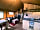 Bozedown Boltholes: Lounge and kitchen area with woodburning stove (photo added by manager on 29/06/2022)