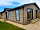 Chestnut Meadow Camping and Caravan Park: Side view of lodge and patio