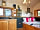 Lower Green Holidays: Double bed and kitchen area