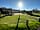 Calloose Caravan Park: Outdoor seating area net to children's play area and outdoor table tennis table