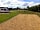 Cresslands Touring Park: View from pitch across the communal area behind the pitches