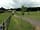 Far Peak Campsite: The entrance to the campsite showing the main road to the small ind estate - in middle of camp plots