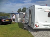 Gravel electric grass touring pitch. Plenty of room to sit outside your van. Gravel electric grass touring pitch. Plenty of room to sit outside your van.