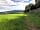 Allercott Farm: View along the top edge of the field over to Croydon Woods