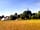 The Crown Inn: View from our van over the camping field towards the Crown and local church.
