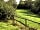 Bowdens Crest Caravan and Camping Park: Dog walking field, with footpath into acres of mature woodland, leading to the River Parrett